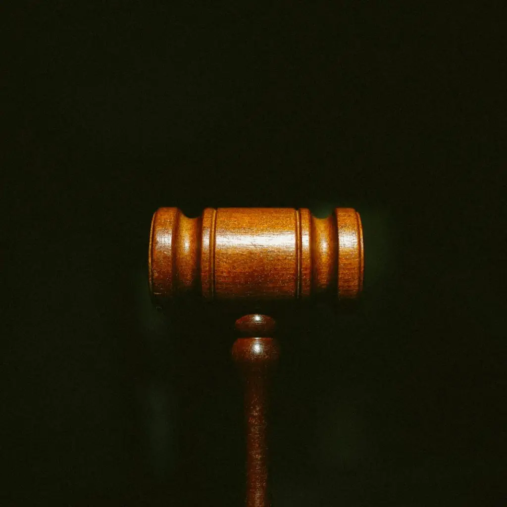 brown wooden stand with black background