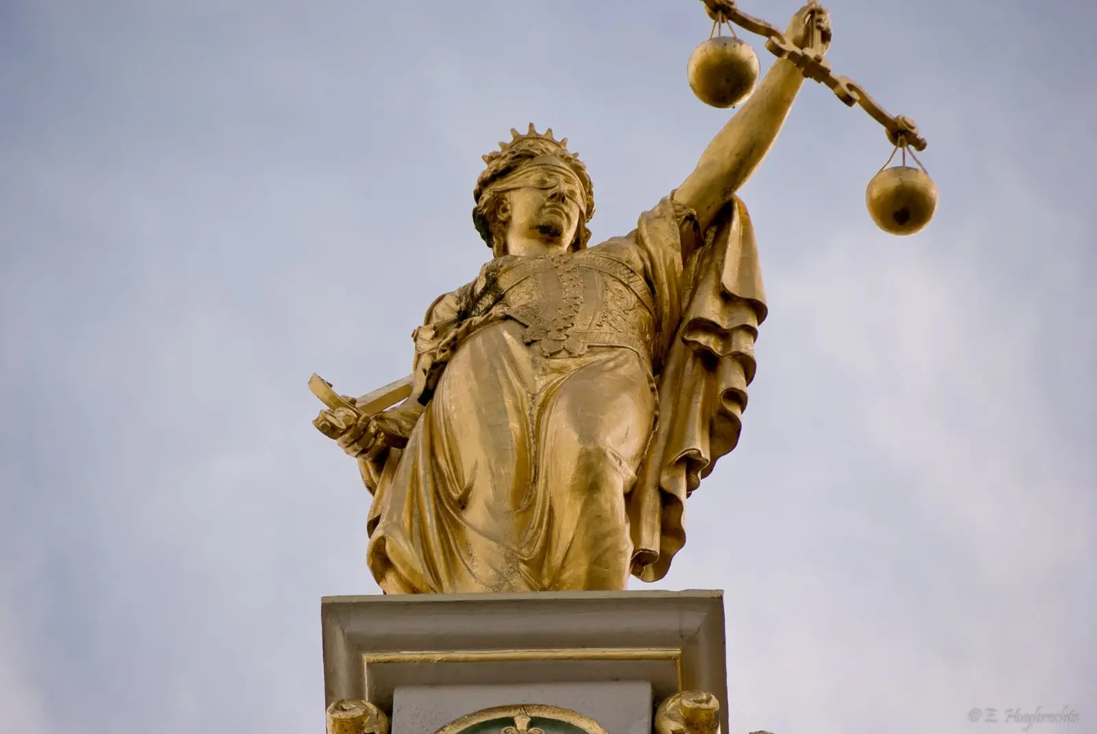 Image credit: https://commons.wikimedia.org/wiki/File:Golden_Lady_Justice,_Bruges,_Belgium_(6204837462).jpg