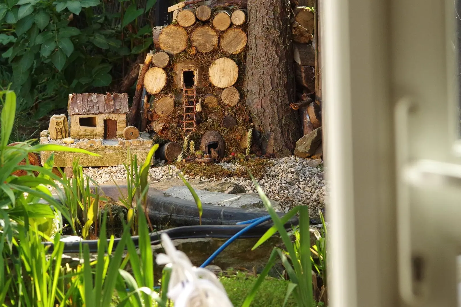 Image credit: Facebook | George the Mouse in a log pile house