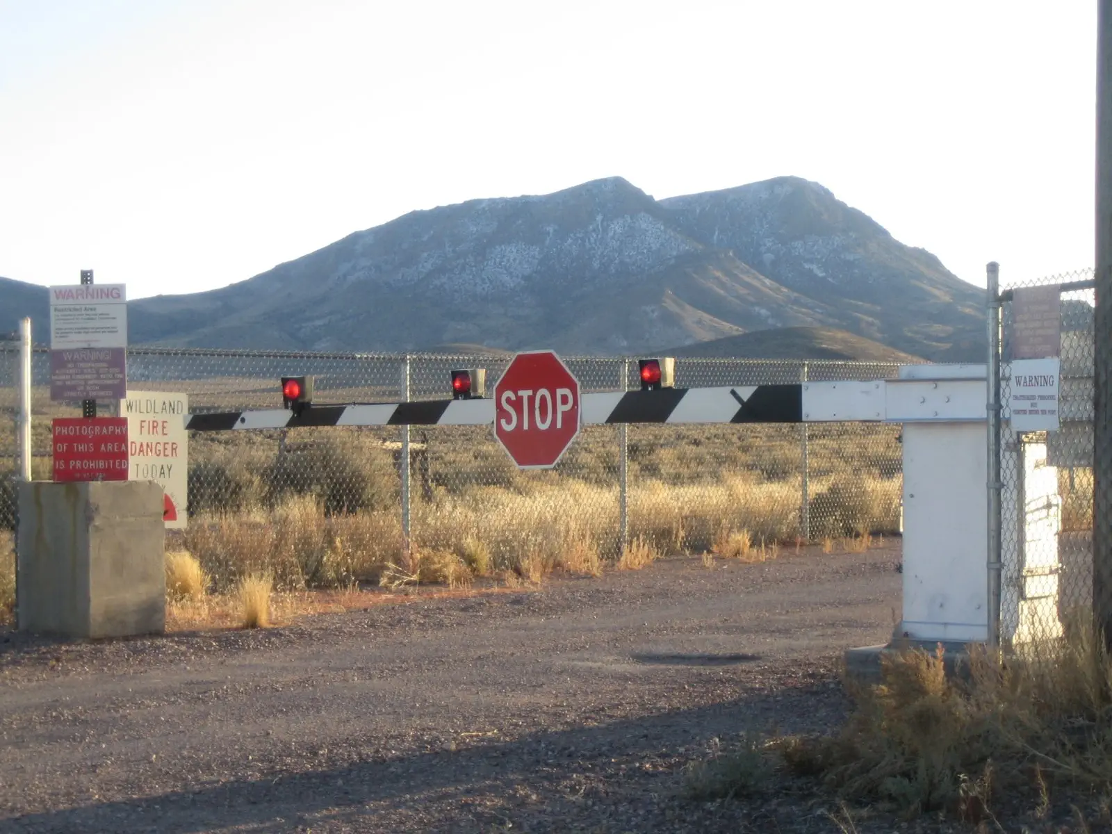 Image credit: https://diplycom5cc47.zapwp.com/q:i/r:0/wp:1/w:1/u:https://commons.wikimedia.org/wiki/File:Back_gate_area_51.jpg